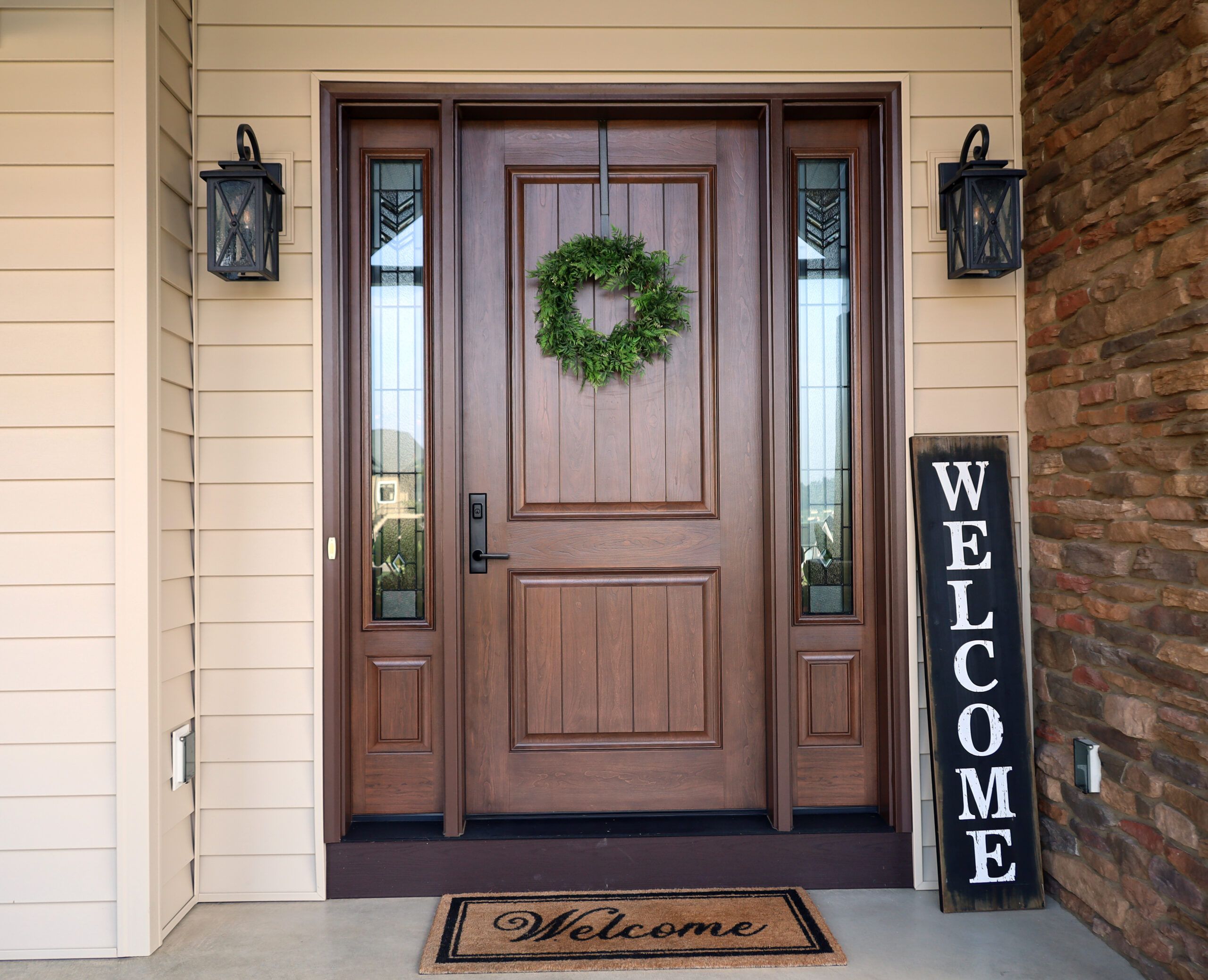 beautiful front door welcome sign on porch